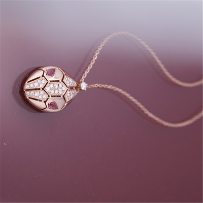 Roman Serpenti necklace in 18 kt rose gold set with rubellite eyes and with pavé diamonds on the head