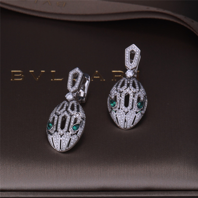 Luxury Gold Brand Serpenti Earrings in 18K White Gold set with Emerald Eyes and with pavé diamonds Snake Head